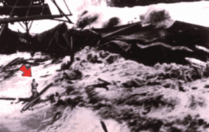Photograph of the Hilo tsunami as it rolls into Hilo Bay