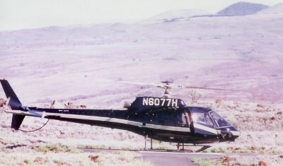 Helicopters fly over the lava flows, valleys and rain forest