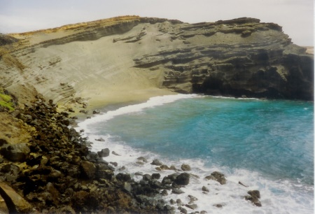 Green Sand Beach close to the southern tip of the island is covered with olivine