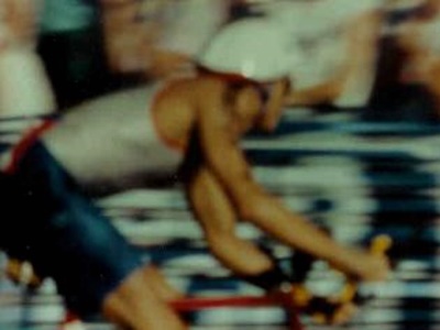 A participant in the Ironman Triathlon gets started on the long bike portion of the race