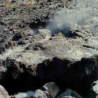 Steam escapes from fissures in the lava floor